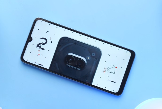 Xiaomi A3 laced on a clean desk, displaying a video to showcase its display picture quality.